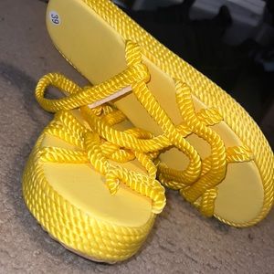 Size 39 European Size (Size 7 US) Yellow braided platform sandals. BRAND NEW!